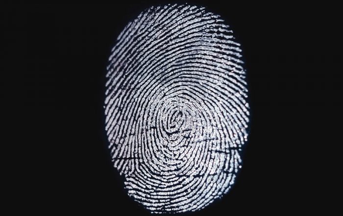white fingerprint against a black blackground