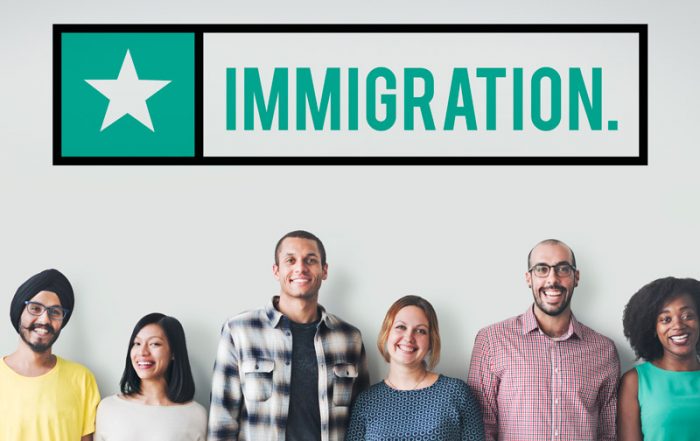 immigration sign and line up of diverse group of adults