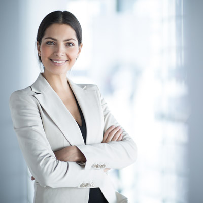 young female executive standing positive